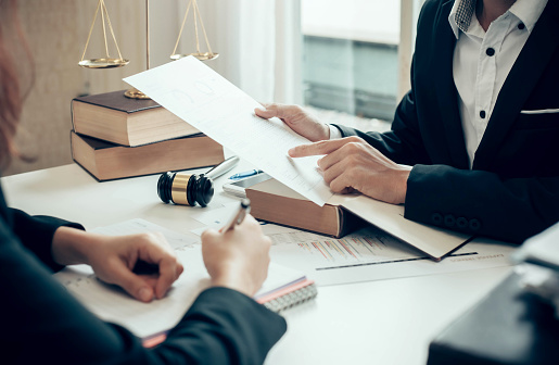 Businessman and lawyer discuss the contract document. Treaty of the law. Sign a contract business.